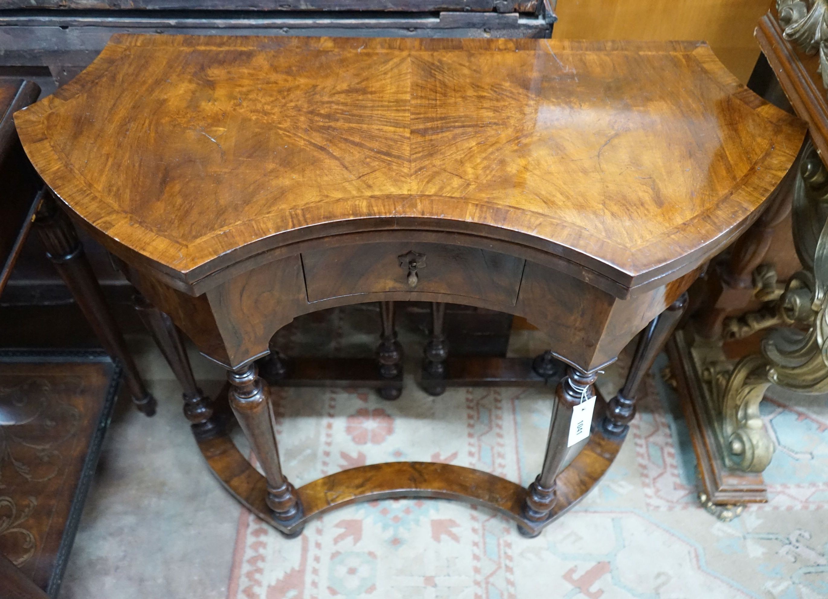 A Queen Anne Revival walnut folding card table, width 84cm, depth 37cm, height 74cm
